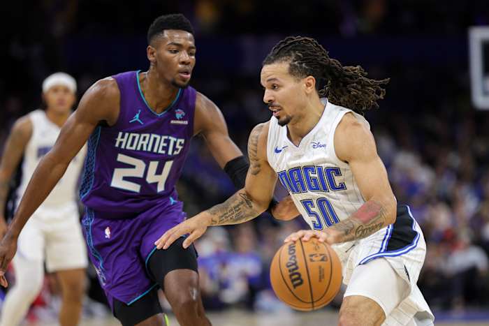 Orlando Magic guard Cole Anthony (50) drives past Charlotte Hornets forward Brandon Miller (24) in the team's win on Sunday